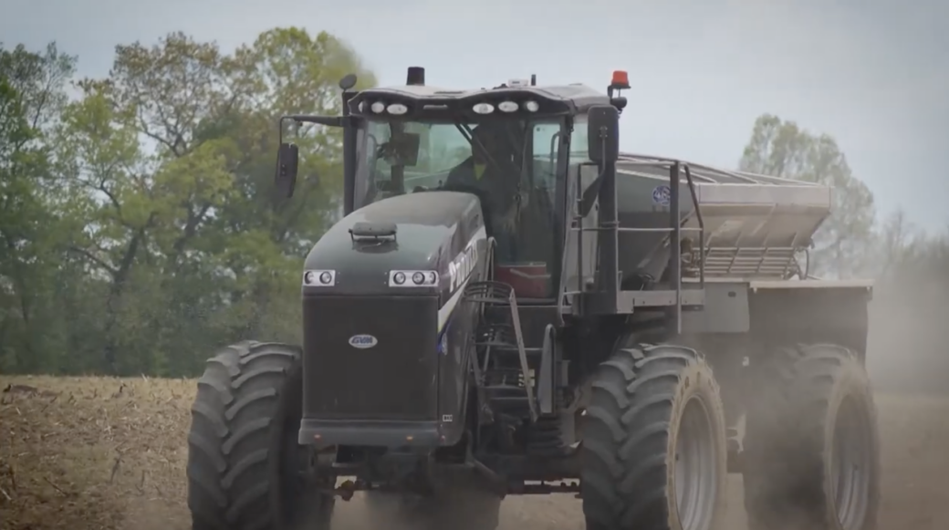 A tractor driving through a field.